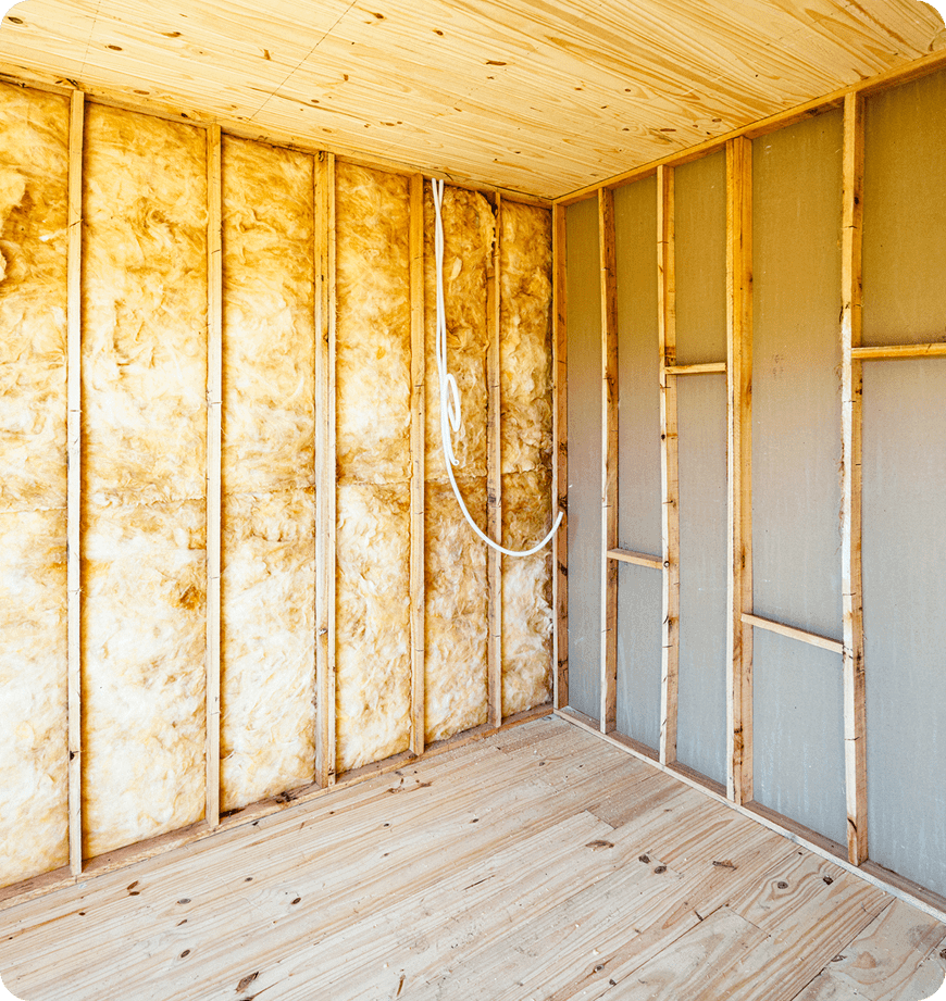 Bare wall during an ongoing insulation installation project.