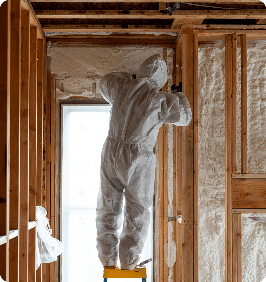 Technician performing a home energy evaluation in a client's home.