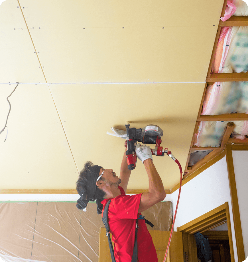A worker helping a client with insulation installation.