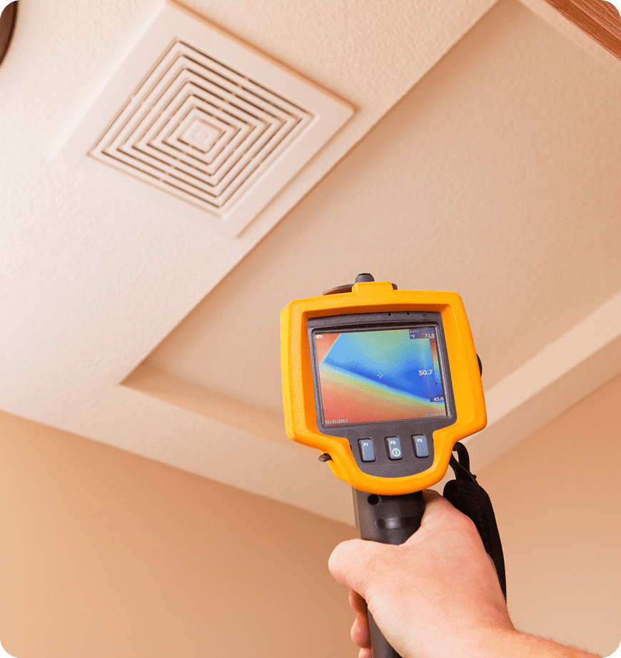 Thermal camera inspecting ceiling air vent.