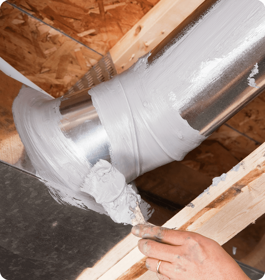 A team member conducting air duct sealing service in Eugene, OR, residence