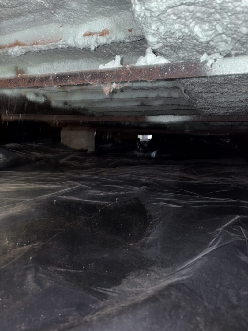 Crawl space with insulation and plastic