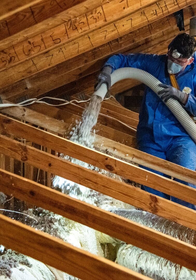 Our staff doing blow in insulation at a Eugene, OR, home.