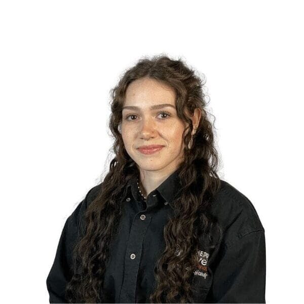 Person with long curly hair smiling